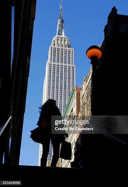 subway exit and empire stae building, new york city - empire state building stock pictures, royalty-free photos & images