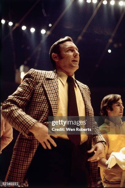 Head Coach Bill Sharman of the Los Angeles Lakers watches his team from the sideline during an NBA game at the Forum circa 1972 in Los Angeles,...