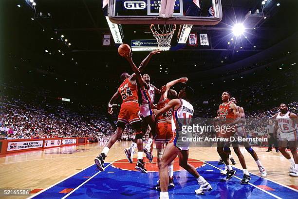 Isiah Thomas of the Detroit Pistons drives to the basket against the Chicago Bulls during an NBA Eastern Conference Finals at The Palace circa 1990...