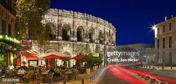 nimes at dusk - nimes stock pictures, royalty-free photos & images