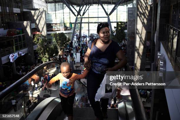 Shoppers inside a mall on May 1, 2013 at Maponya shopping Mall, Soweto, South Africa. Maponya is one of several new shopping malls in the township....