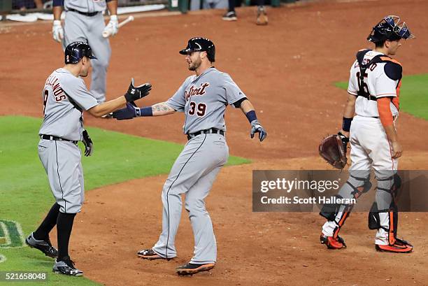 Nick Castellanos of the Detroit Tigers greets Jarrod Saltalamacchia after Saltalamacchia hit a two-run home run in the sixth inning of their game...