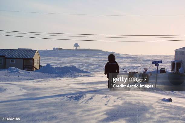 person walking in cambridge bay - nunavut foto e immagini stock