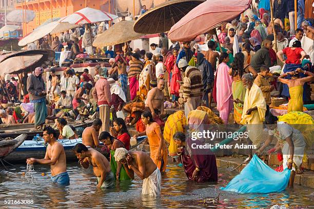 pilgrims bathing in the ganges - varanasi ganges stock pictures, royalty-free photos & images