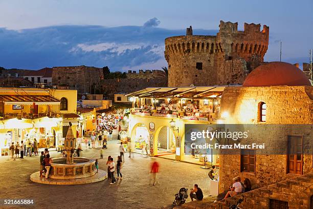 hippocrates square and parts of the medieval fortification in the historic old town of rhodes - dodecanese islands - fotografias e filmes do acervo