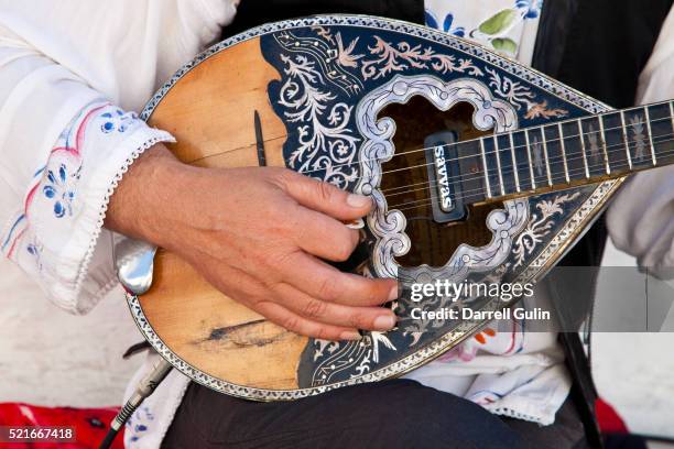 musical instrument by street player greek island of mykonos - mandolin stock pictures, royalty-free photos & images