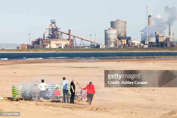 a party of young people having a barbeque on the beach at teesmouth, uk. - beach barbeque fotografías e imágenes de stock