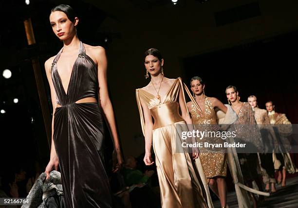Models walk down the runway during the Marc Bouwer 2005 fashion show during Olympus Fashion Week February 9, 2005 in New York City.