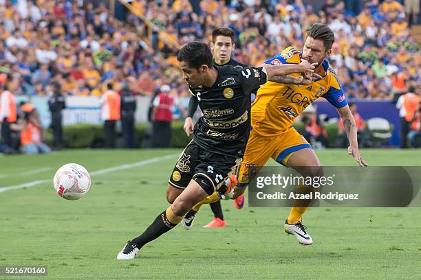 Rafael Sobis of Tigres fights for the ball with Severo Meza of Dorados during the 14th round match between Tigres UANL and Dorados de Sinaloa as part...