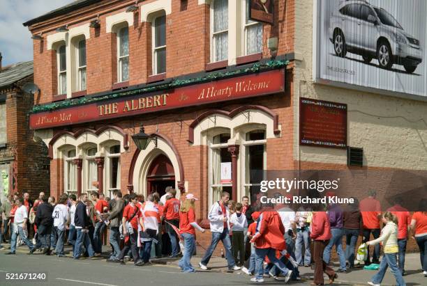 soccer fans heading to the albert pub - england football fans stock pictures, royalty-free photos & images