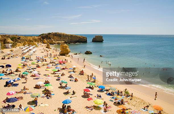 tourists on praia de san raphael in portugal - albufeira stock pictures, royalty-free photos & images