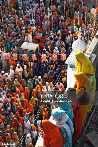 sikh devotees in procession near sachkhand sahib gurudwara, nanded, maharashtra, india - punjab aerial view stock pictures, royalty-free photos & images