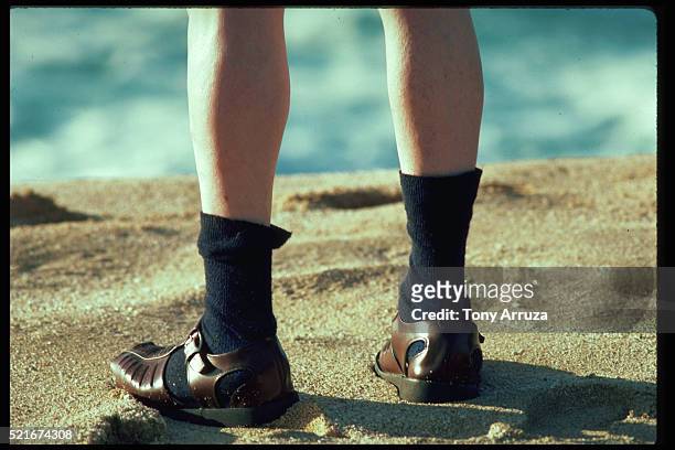 man wears sandals and socks - sandales photos et images de collection