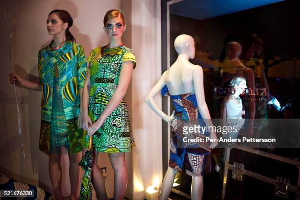 Models stand during an installation fashion show at the new Klûk CGDT flagship store during Mercedes-Benz Fashion Week on July 26 in Cape Town, South...