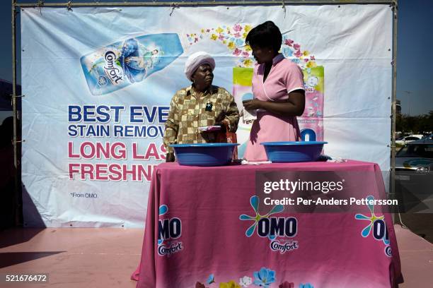 Hoppers attend a promotion for a detergent brand on May 1, 2013 at Maponya shopping Mall, Soweto, South Africa. Maponya is one of several new...