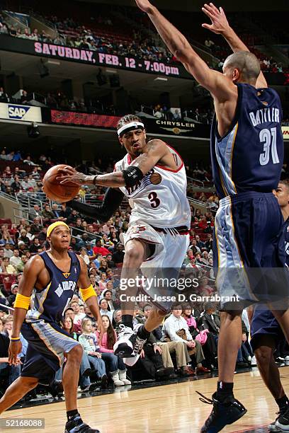 Allen Iverson of the Philadelphia 76ers drives against Shane Battier of the Memphis Grizzlies on February 9, 2005 at the Wachovia Center in...