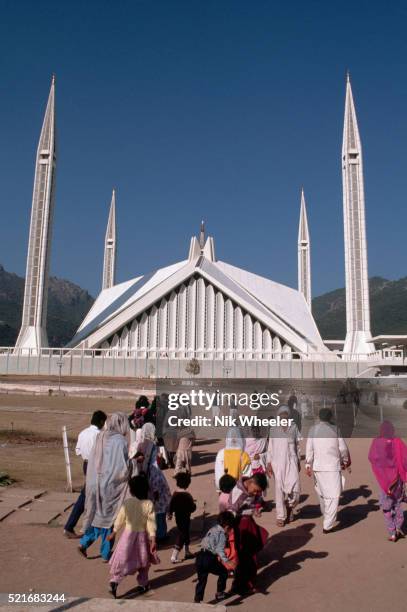 Worshipers come and go from the Shah Faisal Mosque in Islamabad, Pakistan.