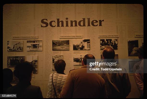visitors looking at wall dedicated to oskar schindler - oskar schindler stock pictures, royalty-free photos & images