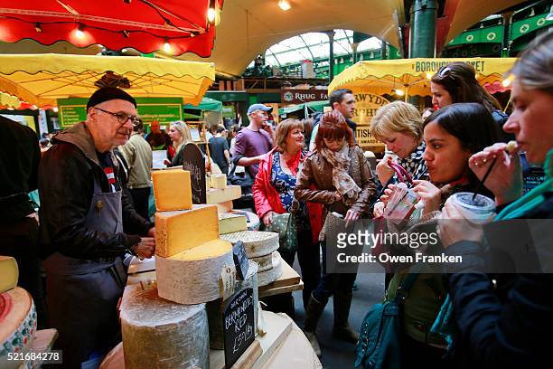 a cheese stand in borough market, london - borough market london stock pictures, royalty-free photos & images