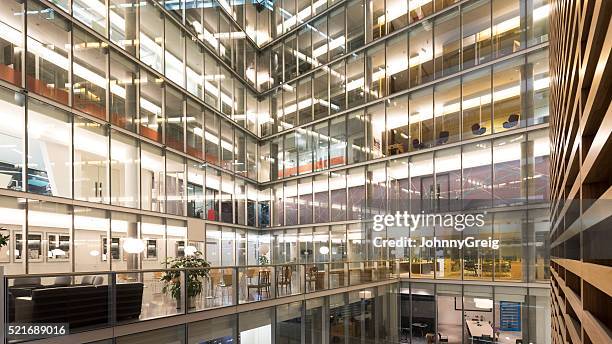 interior atrium of modern office building - atrium stock pictures, royalty-free photos & images