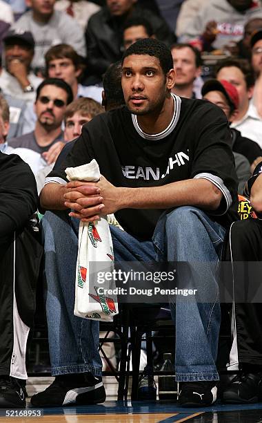 Tim Duncan of the San Antonio Spurs watches the action against the Washington Wizards as he sat out due to an injured ankle as the Wizards defeated...