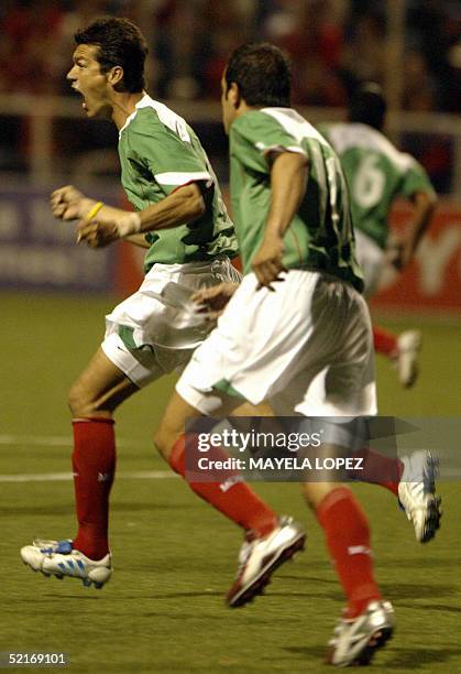 Mexican Jaime Lozano and Cuauhtemoc Blanco celebrate their goal at the Ricardo Saprissa Stadium 09 February 2005 in a FIFA 2006 World Cup North and...