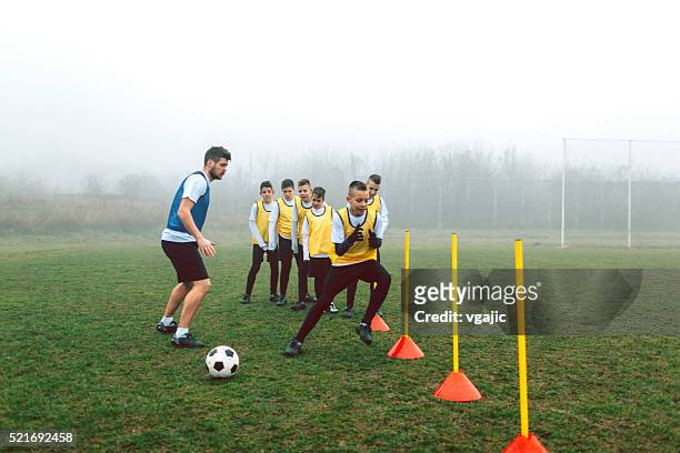 kids soccer training. - coach stock pictures, royalty-free photos & images