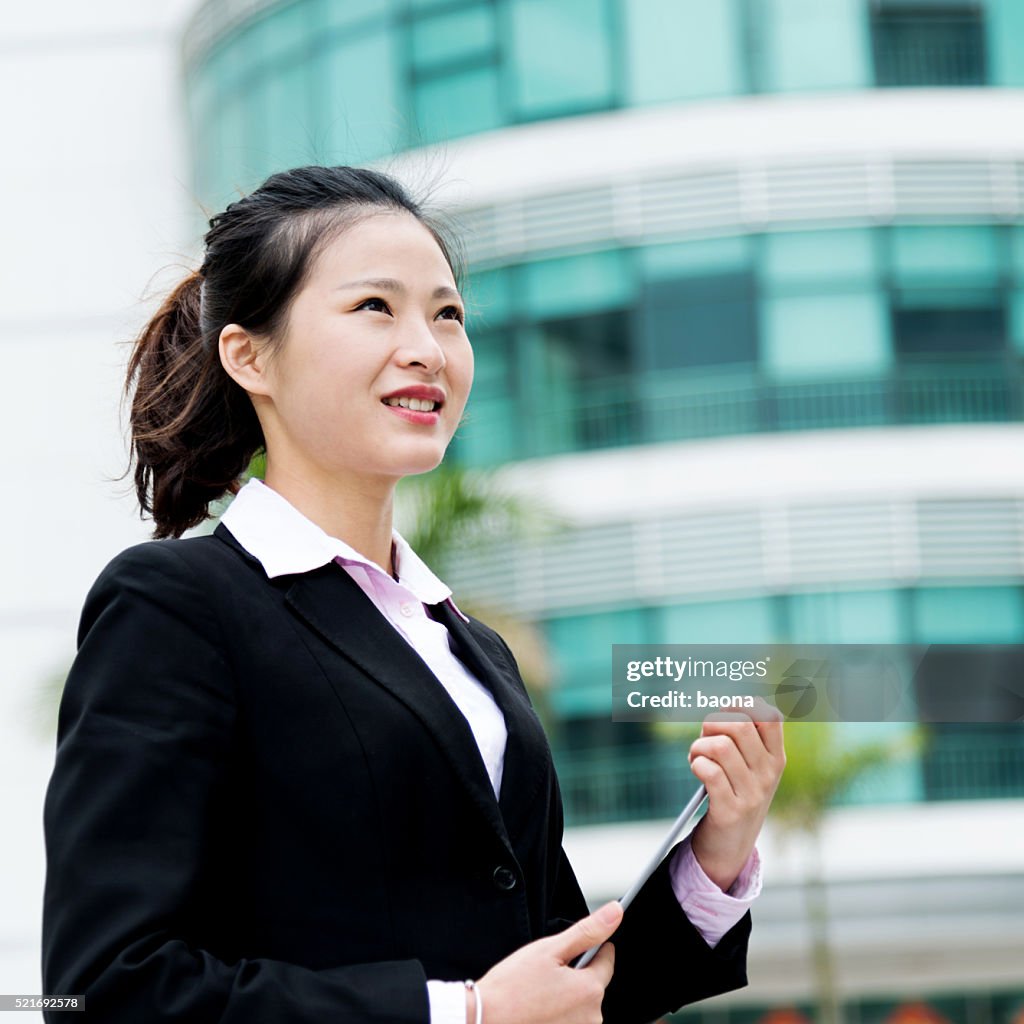Attractive businesswoman using digital tablet
