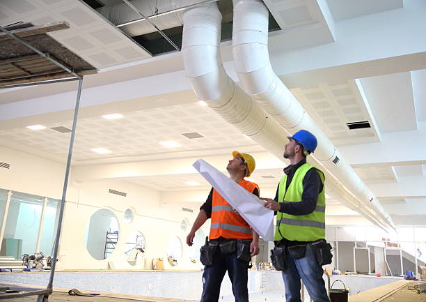 construction workers reading blueprints - inspection construction stock pictures, royalty-free photos & images