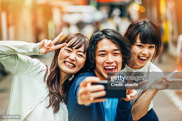 funny pose for selfie - guy girl street laugh stock pictures, royalty-free photos & images