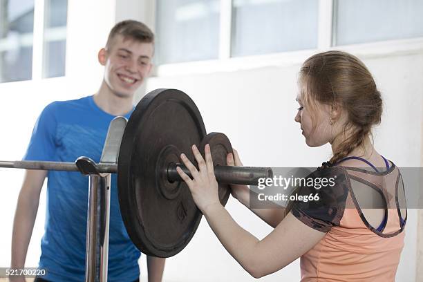 group of teenagers playing sports - barbell stock pictures, royalty-free photos & images
