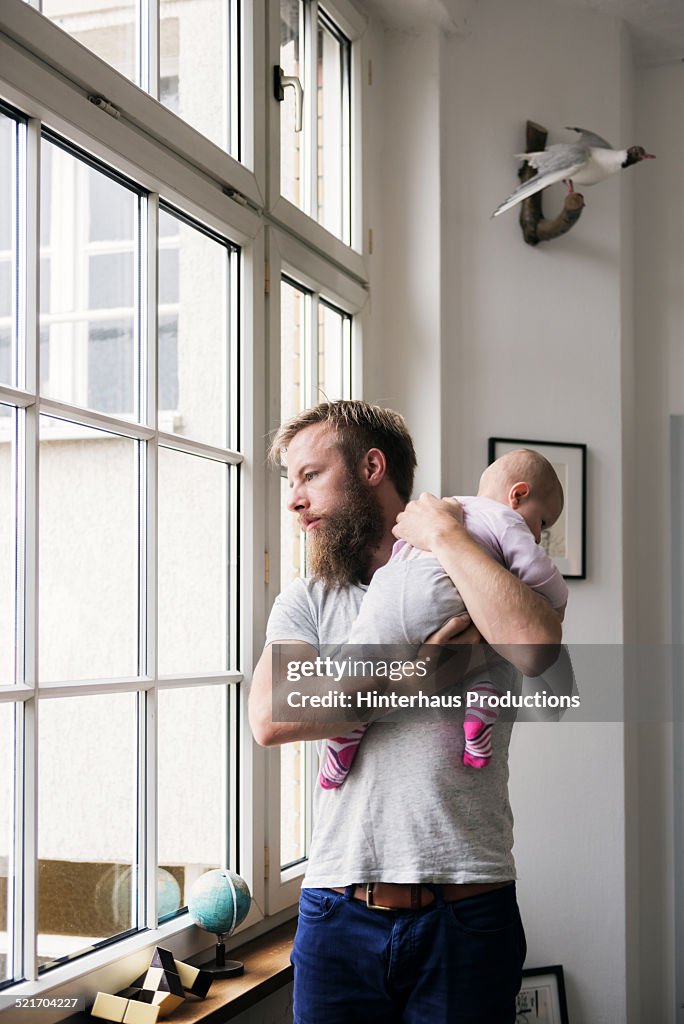 Young Father With Newborn Baby