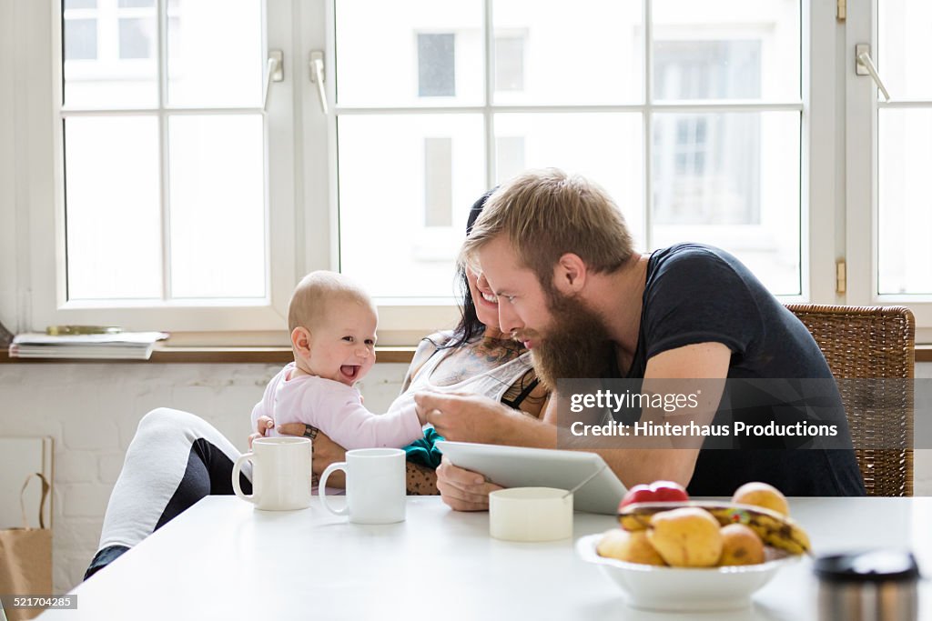 Young Family With Baby having Fun