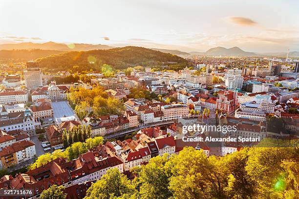 ljubljana cityscape seen from above at sunset, slovenia, eu - ljubljana slovenia stock pictures, royalty-free photos & images