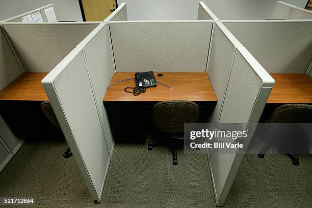 empty office cubicles - downsizing stock pictures, royalty-free photos & images