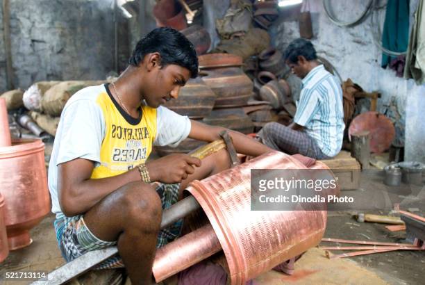 making of copper utensils in vessel manufacturing industry in anupparpalayam metal town, tirupur, tamil nadu, india - copper art india stock pictures, royalty-free photos & images