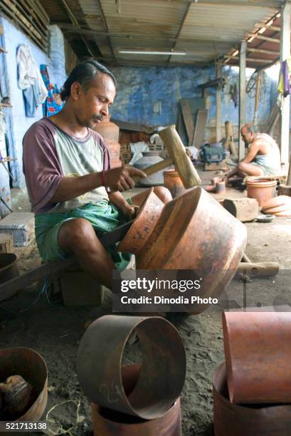 making of copper utensils in vessel manufacturing industry in anupparpalayam metal town, tirupur, tamil nadu, india - copper art india stock pictures, royalty-free photos & images