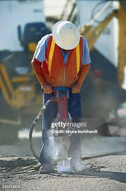 construction worker using a jackhammer - casino worker foto e immagini stock