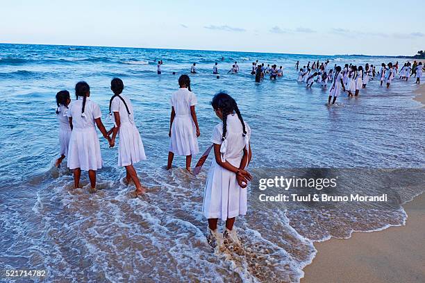 sri lanka, trincomalee, shcool girls play on the sea - trincomalee stock pictures, royalty-free photos & images