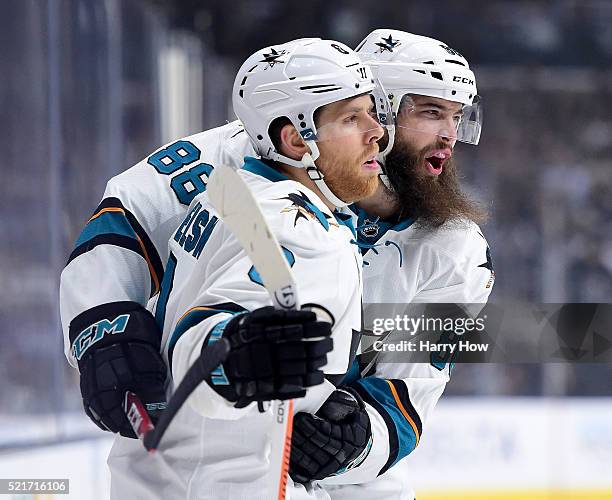 Joe Pavelski of the San Jose Sharks celebrates his goal with Brent Burns to take a 1-0 lead over the Los Angeles Kings during the first period in...
