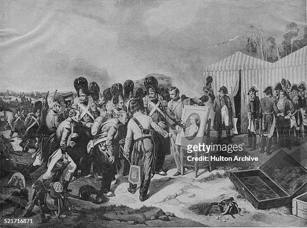 Soldiers of the Imperial Guard of the French Grande Armee gather to look at the portrait by Francois Gerard of the baby Napoleon II, the King of...