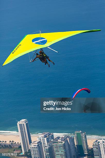 hang gliding in rio de janeiro. - sao conrado beach stock pictures, royalty-free photos & images