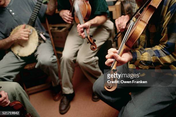 bluegrass musicians rehearsing - country and western music stock-fotos und bilder
