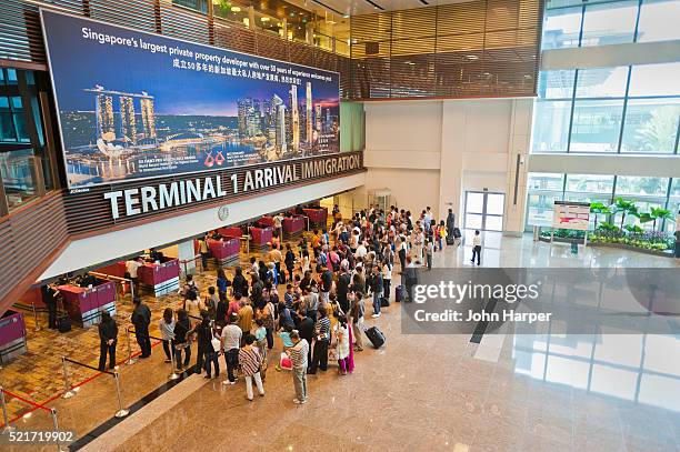 arrival terminal at changi airport, singapore - changi airport stock pictures, royalty-free photos & images