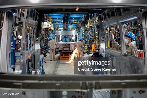 Welders Working on Assembly Line