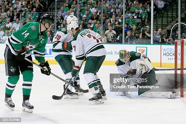 Devan Dubnyk of the Minnesota Wild blocks a shot on goal by Jamie Benn of the Dallas Stars in the third period in Game Two of the Western Conference...