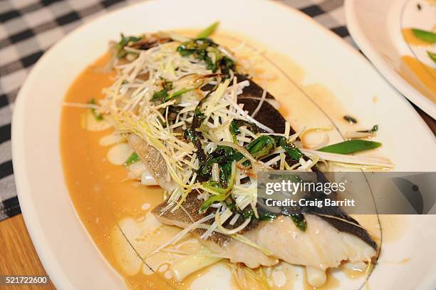 View of steamed black cod, french condiments, and a la chinoise dish at The 8th Annual New York Culinary Experience Private Dinner Hosted By New York...