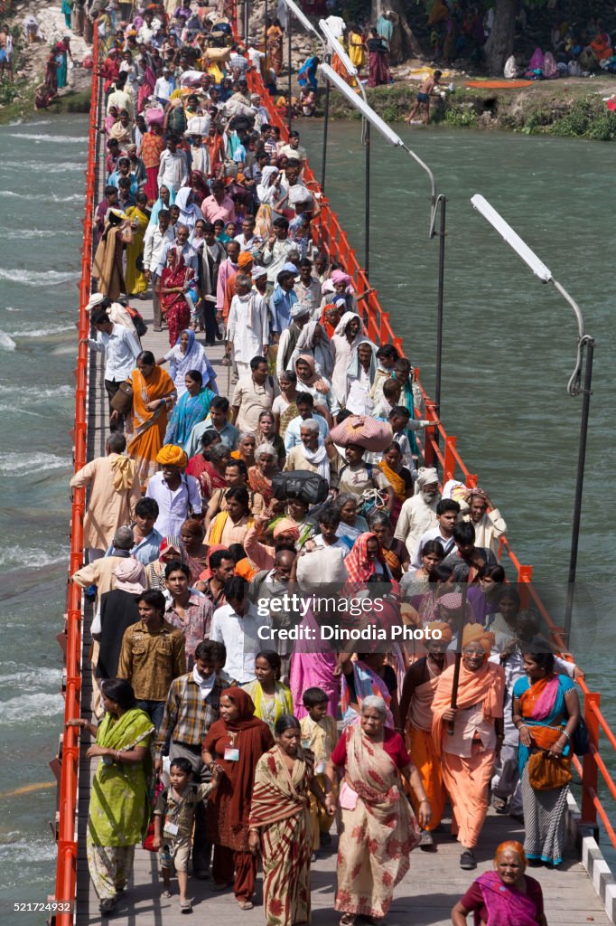 Devotees crossing bridge Ganga river, Haridwar, Uttarakhand, India, Asia