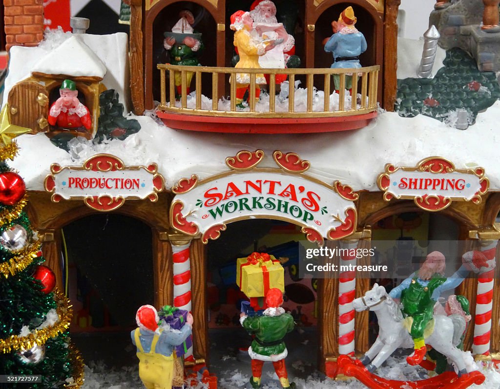 Model Christmas village with miniature houses, people, winter-scene, Santa's workshop