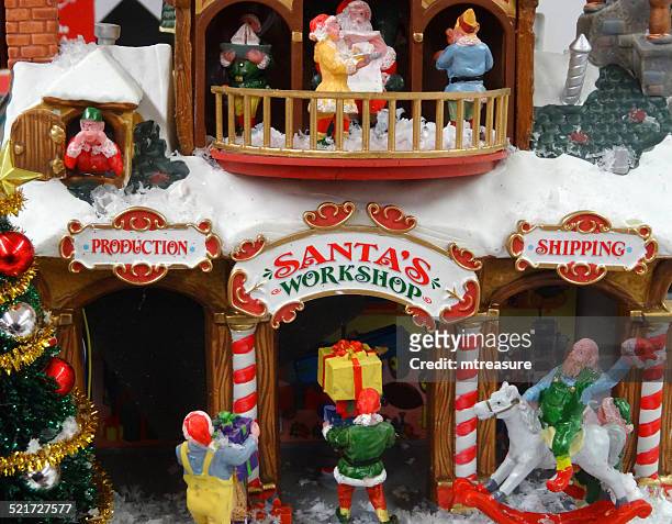 model christmas village with miniature houses, people, winter-scene, santa's workshop - elf workshop stock pictures, royalty-free photos & images
